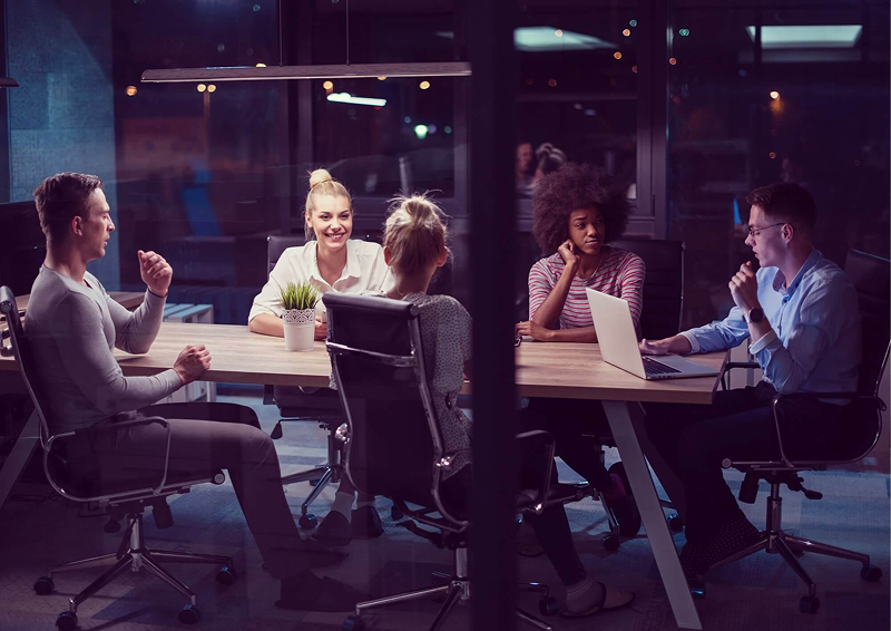 Group of people in a modern office. They are discussing a project.
